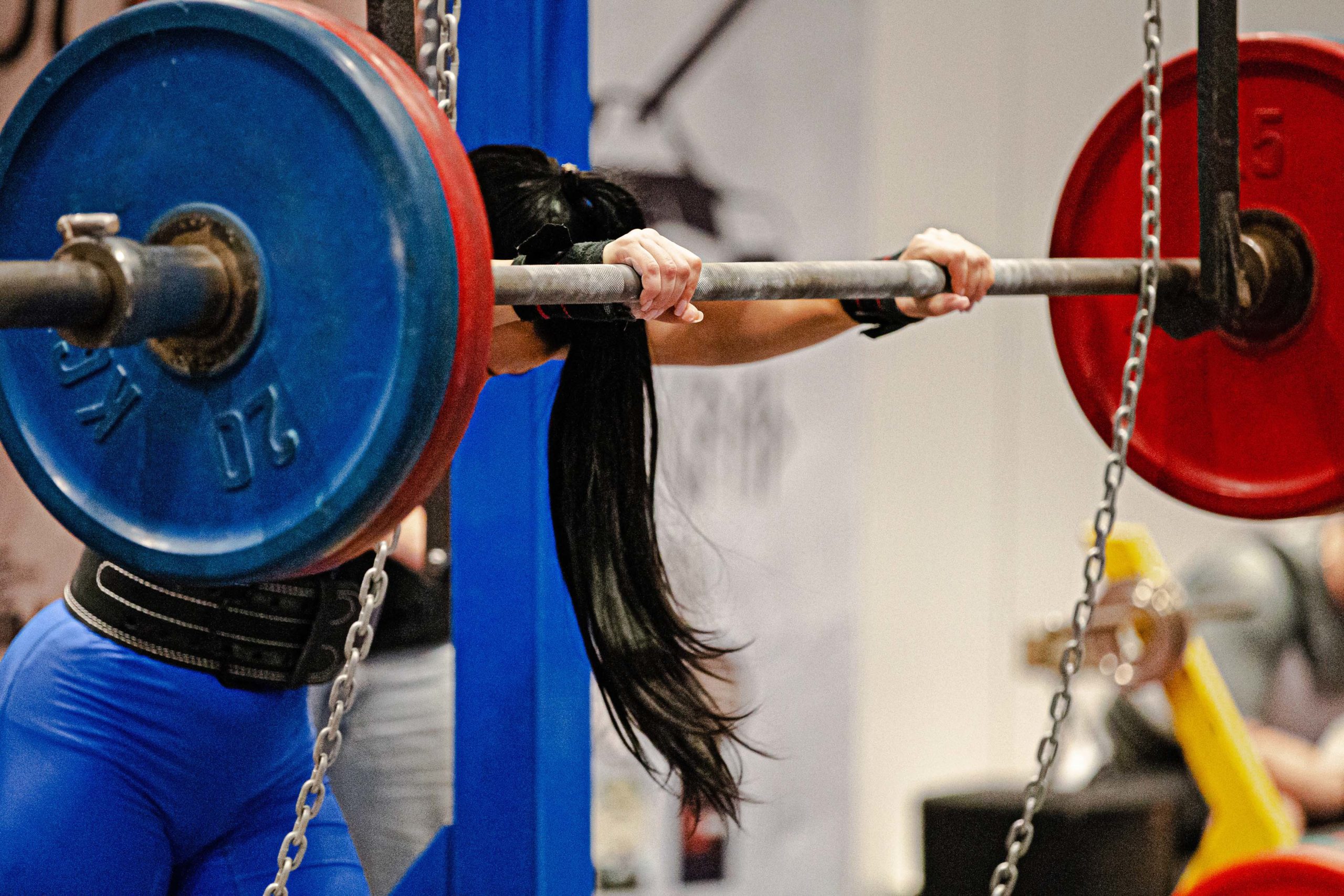female powerlifter squat exercise