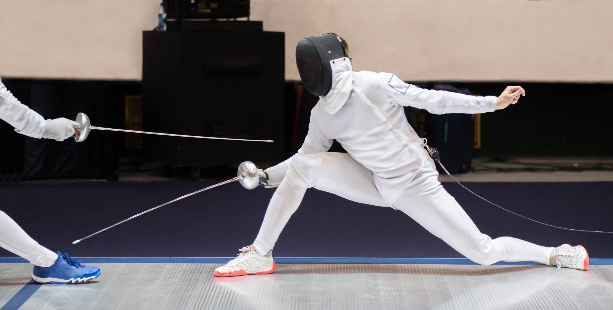 Fencer woman with fencing sword. Fencers duel concept