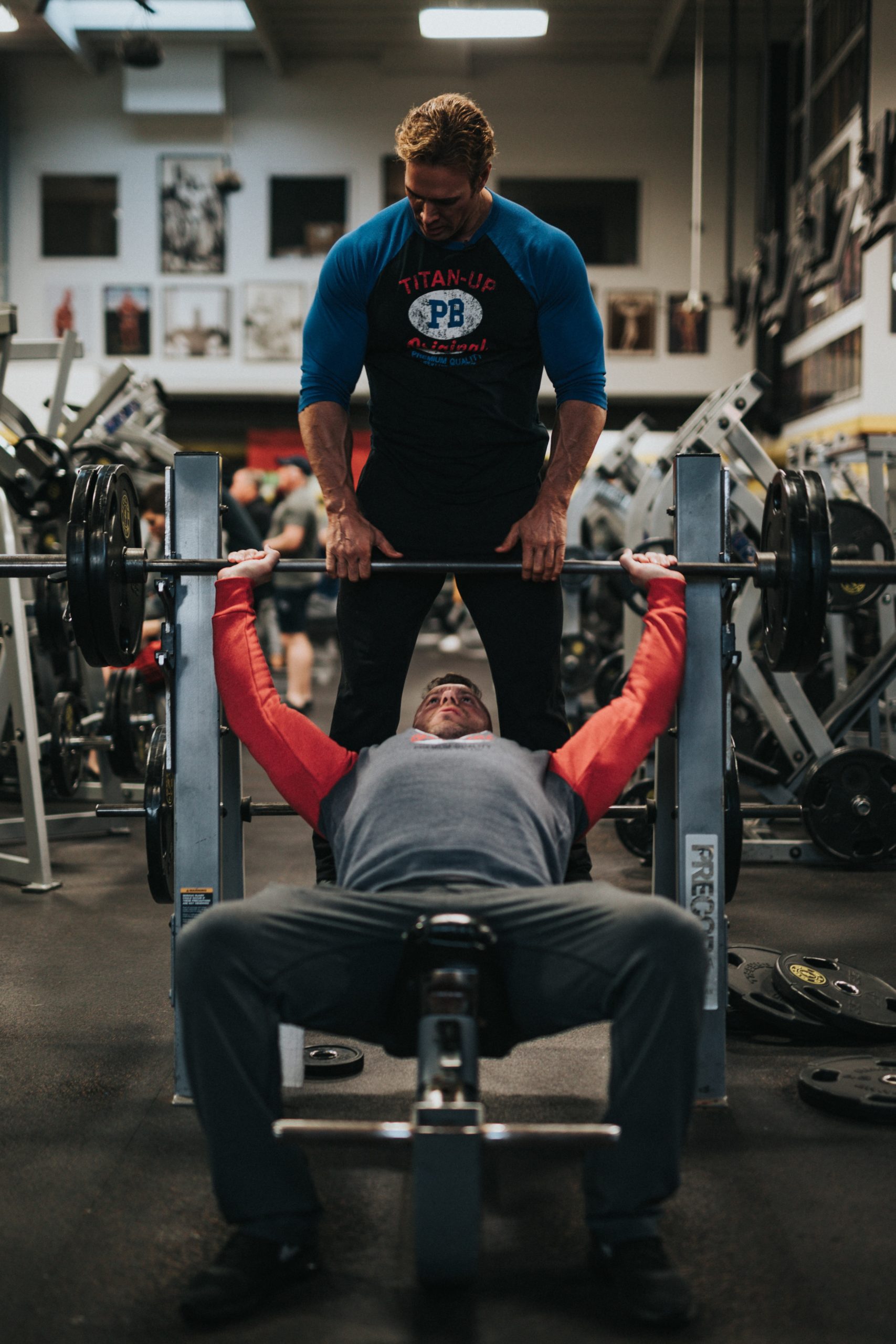 Overhead view of woman having bench press training in gym