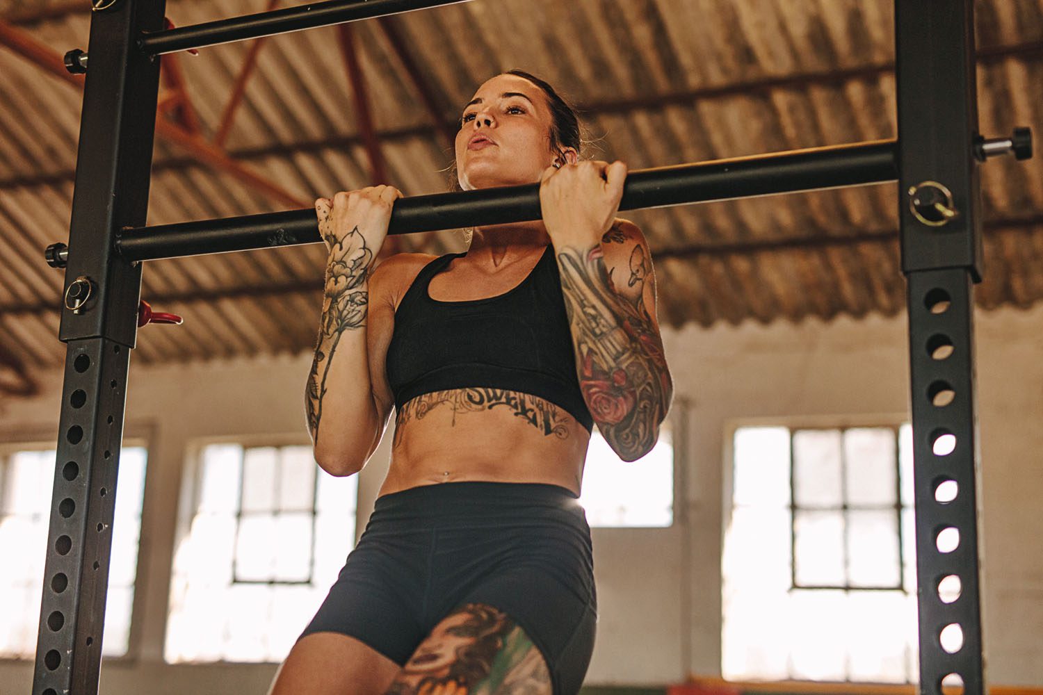 athlete doing chin ups for bicep strength