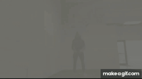 Squat Jump Man doing plyometric exercise single squat jump on turf in gym