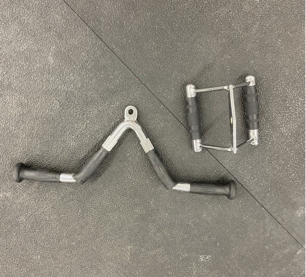 Grip handles used for T-bar row on gym floor.
