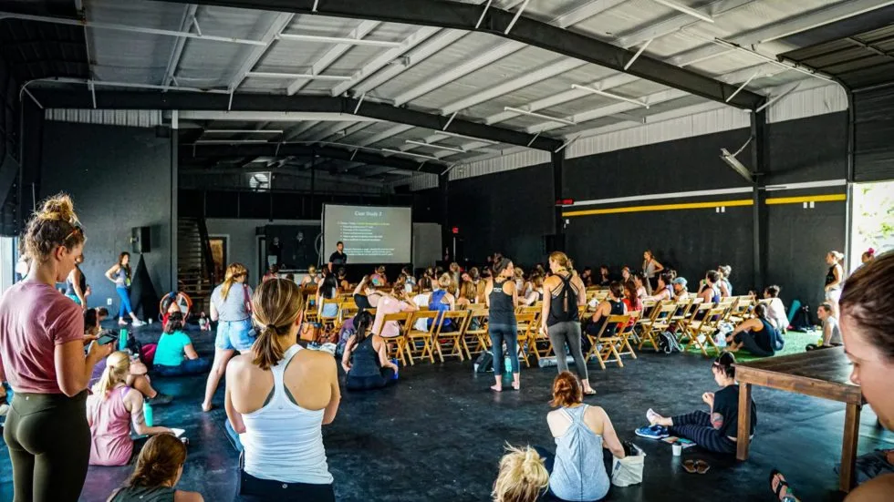 A crowd of women in a workout gym