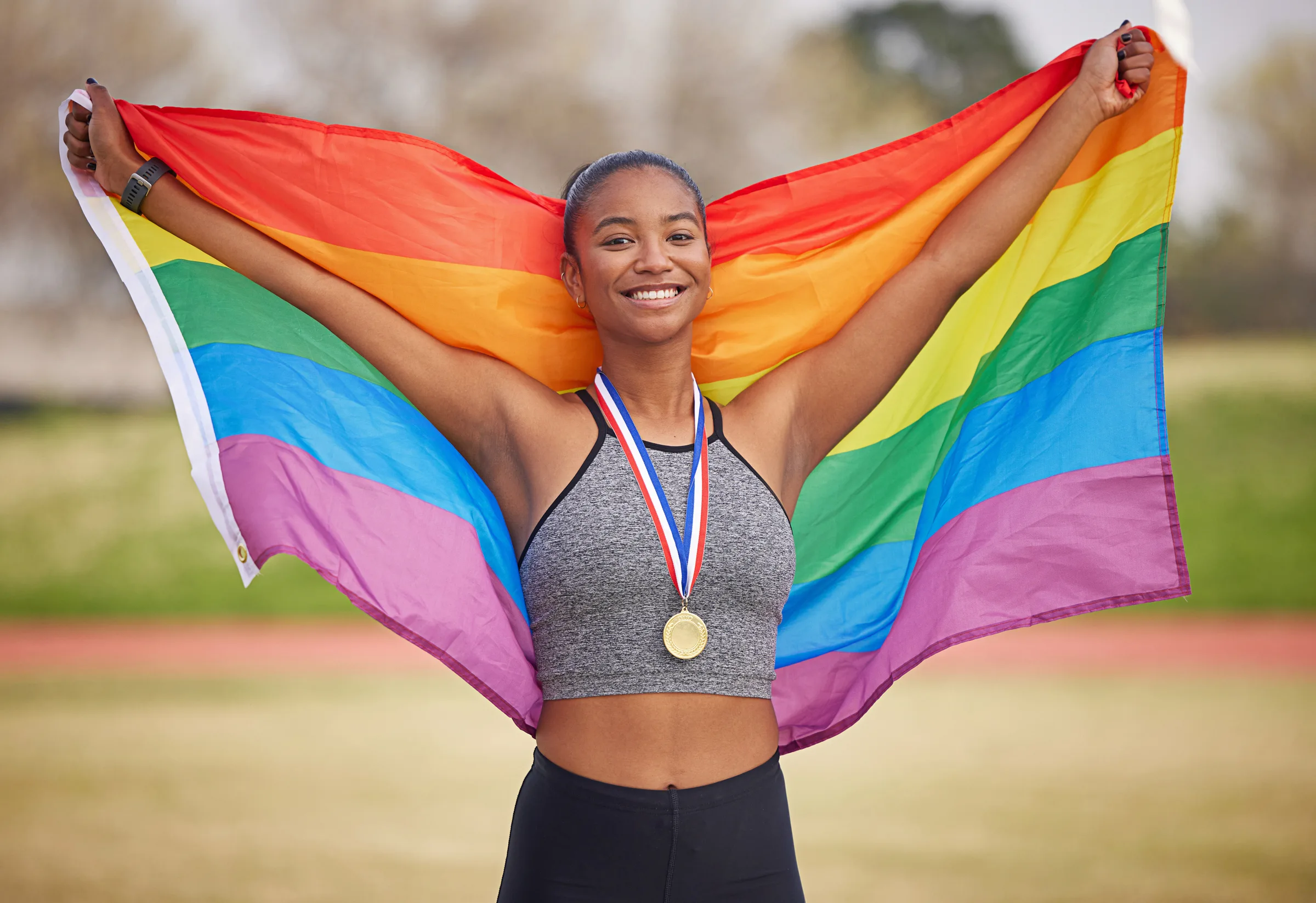 Portrait of happy young people wearing activewear working out