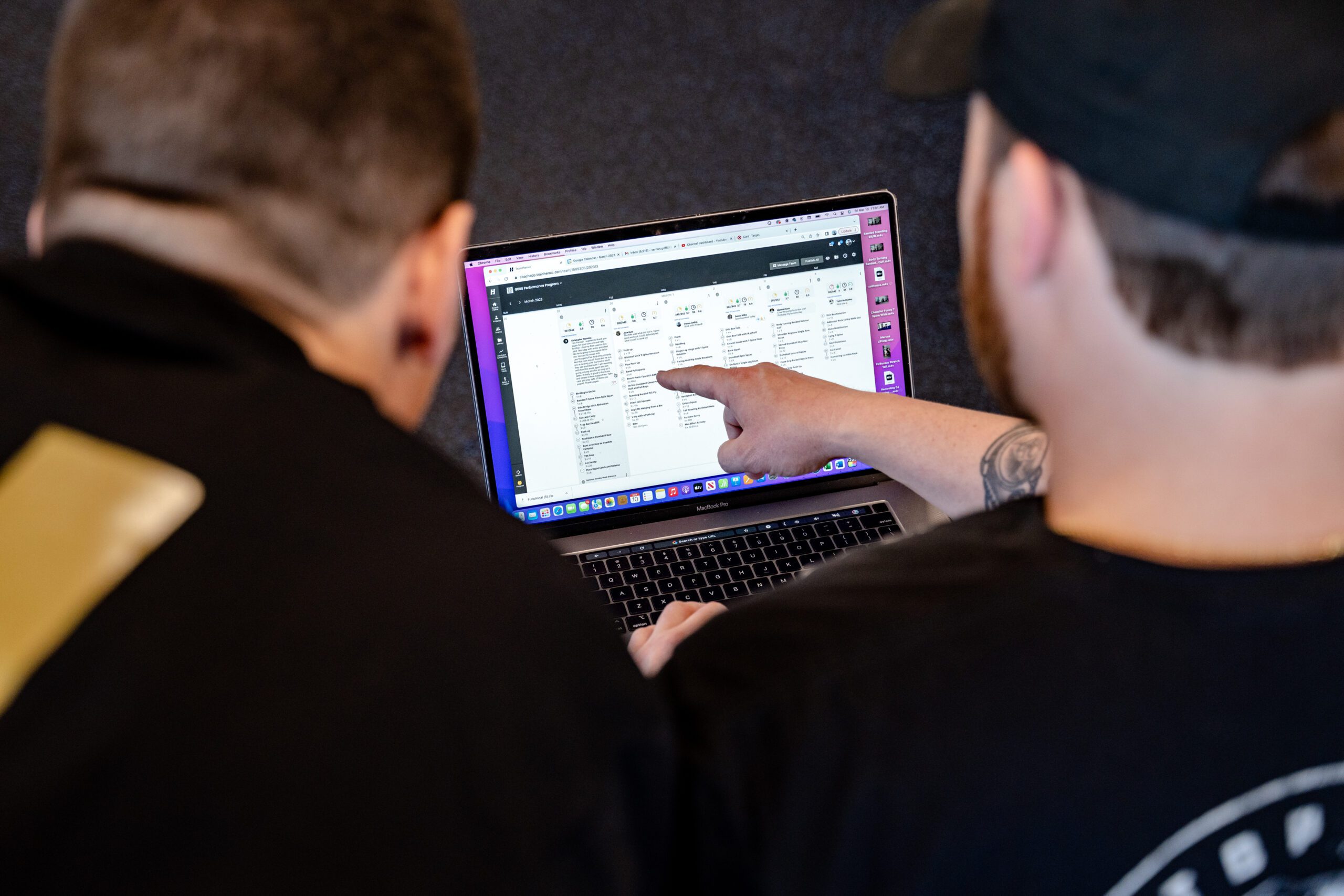Strength athlete standing by barbell in between reps