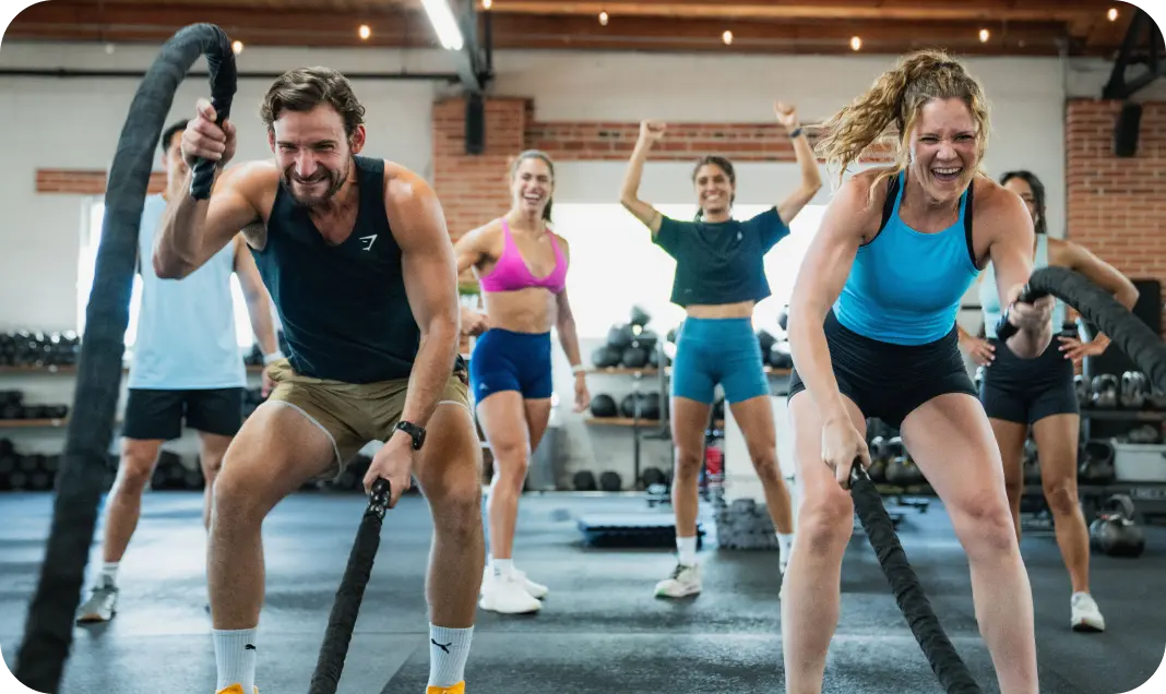 Athletes Training with Ropes Smiling