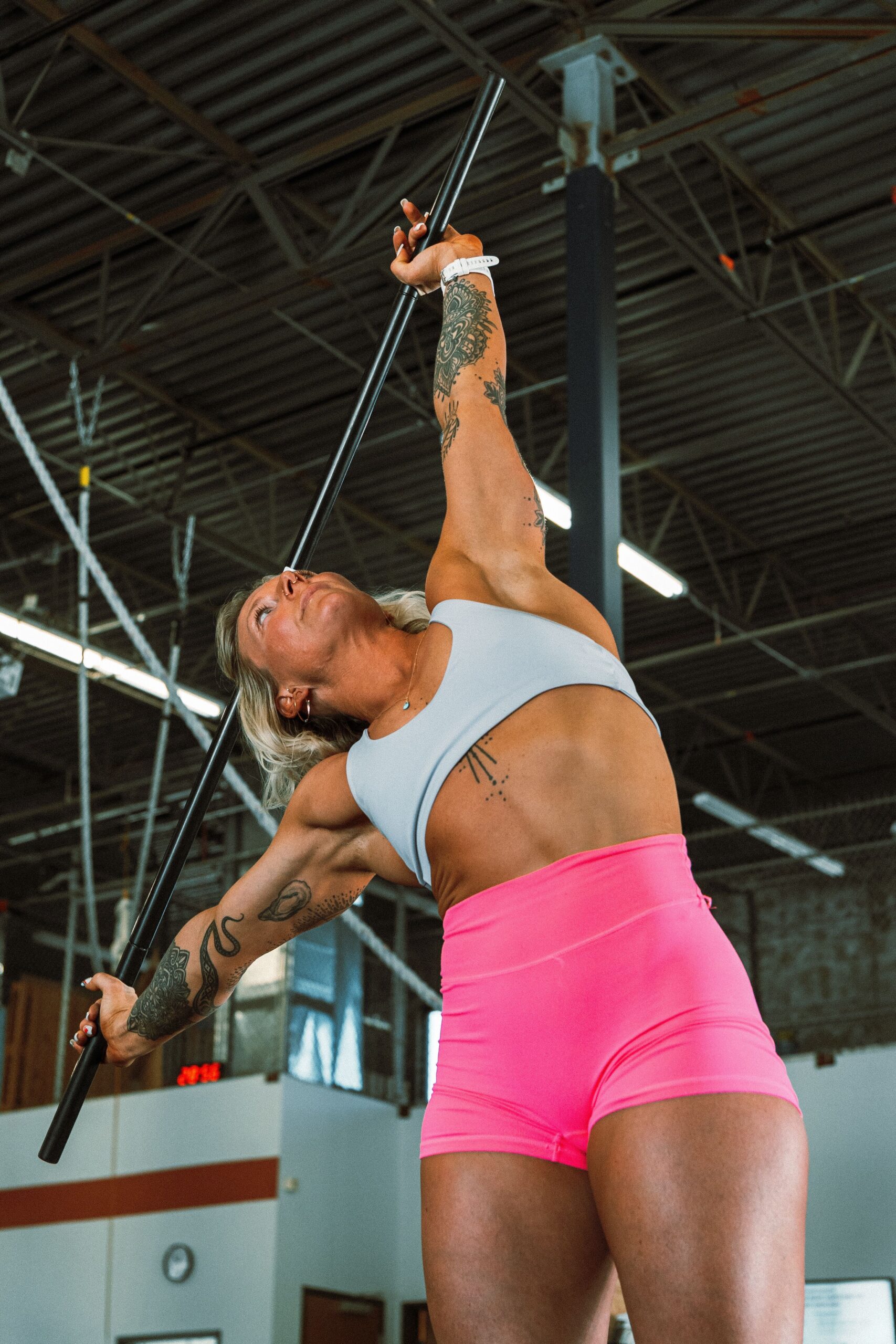 Women strength and conditioning athlete warming up her body